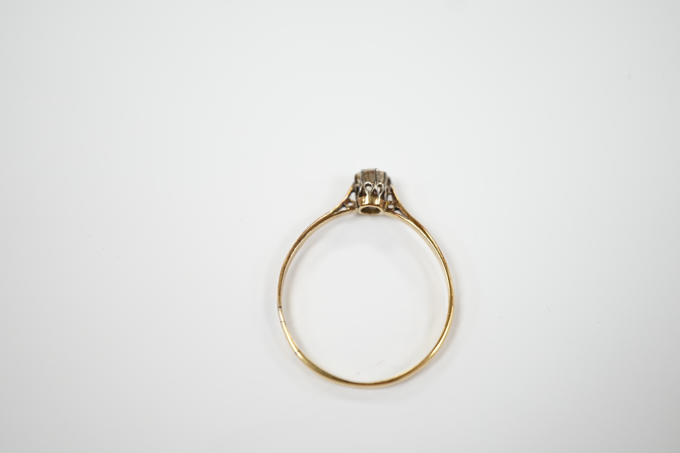 A 1920's 18ct gold and solitaire diamond set ring, size V, gross weight 1.8 grams.